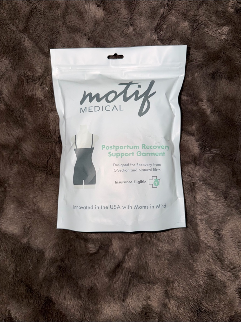 Motif postpartum garment